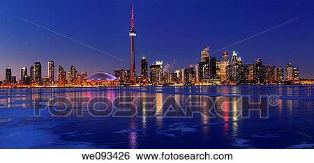 Panorama of frozen ice covered Lake Ontario reflecting the lights of Toronto city skyline at dusk View Large Photo Image Stock Photograph - Panorama of frozen ice covered Lake Ontario reflecting the lights of Toronto city skyline at dusk. Fotosearch