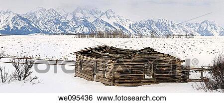 Panorama of the Teton Range mountains in Wyoming with collapsed Shane Cabin in winter View Large Photo Image Stock Photograph - Panorama of the Teton Range mountains in Wyoming with collapsed Shane Cabin in winter. Fotosearch