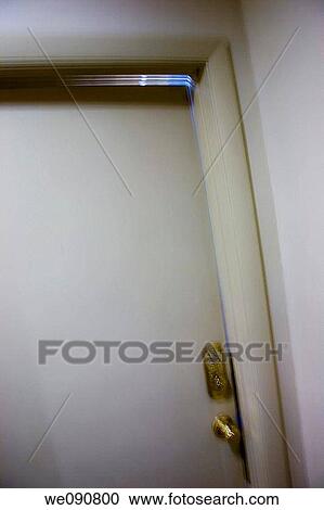 Partially opened office door View Large Photo Image Stock Image - Partially opened office door. Fotosearch