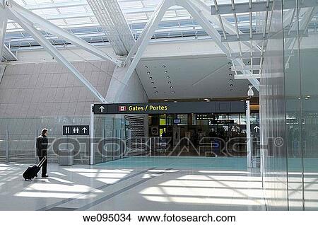 Passenger entering departure gates to domestic flights at Pearson International Airport Terminal 1 Toronto View Large Photo Image Picture - Passenger entering departure gates to domestic flights at Pearson International Airport Terminal 1 Toronto. Fotosearch
