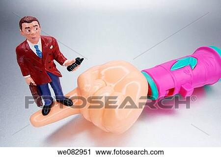 Plastic Hand with Businessman Figurine View Large Photo Image Stock Image - Plastic Hand with Businessman Figurine. Fotosearch