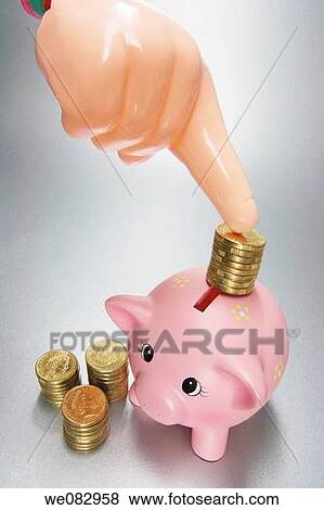Plastic Hand with Coins and Piggy Bank View Large Photo Image Stock Photo - Plastic Hand with Coins and Piggy Bank. Fotosearch
