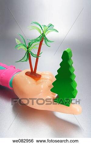 Stock Photograph - Plastic Hand with Miniature Trees. Fotosearch