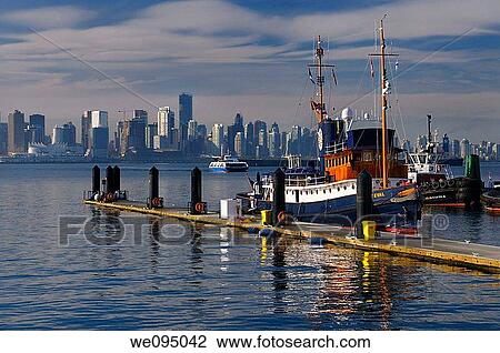 Police boat on Lonsdale Quay with Vancouver skyline coal cargo ship and Seabus ferry View Large Photo Image Stock Image - Police boat on Lonsdale Quay with Vancouver skyline coal cargo ship and Seabus ferry. Fotosearch