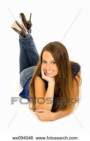 Portrait of a Caucasian woman laying on a white background View Large Photo Image Stock Photograph - Portrait of a Caucasian woman laying on a white background. Fotosearch