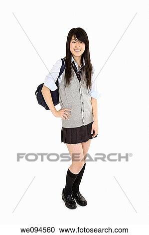 Portrait of a female Asian teenager dressed in the traditional Japanese schoolgirl clothing Uniforms are worn by most of the female school children in Japan She is standing on a white background and smiling View Large Photo Image Stock Image - Portrait of a female Asian teenager dressed in the traditional Japanese schoolgirl clothing Uniforms are worn by most of the female school children in Japan She is standing on a white background and smiling. Fotosearch
