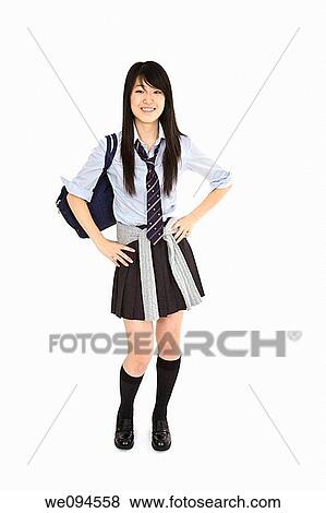 Portrait of a female Asian teenager dressed in the traditional Japanese schoolgirl clothing Uniforms are worn by most of the female school children in Japan She is standing on a white background and smiling View Large Photo Image Stock Photo - Portrait of a female Asian teenager dressed in the traditional Japanese schoolgirl clothing Uniforms are worn by most of the female school children in Japan She is standing on a white background and smiling. Fotosearch