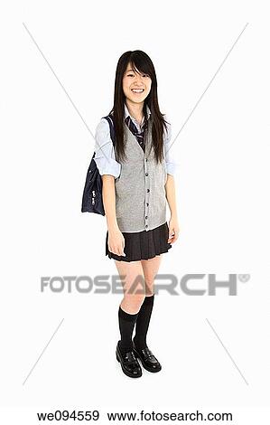 Portrait of a female Asian teenager dressed in the traditional Japanese schoolgirl clothing Uniforms are worn by most of the female school children in Japan She is standing on a white background and smiling View Large Photo Image Stock Photo - Portrait of a female Asian teenager dressed in the traditional Japanese schoolgirl clothing Uniforms are worn by most of the female school children in Japan She is standing on a white background and smiling. Fotosearch