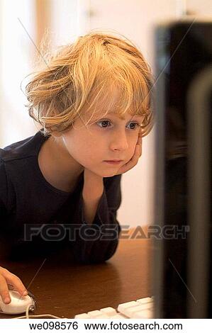 Portrait of a little girl playing on an apple computer at home View Large Photo Image Stock Photograph - Portrait of a little girl playing on an apple computer at home. Fotosearch