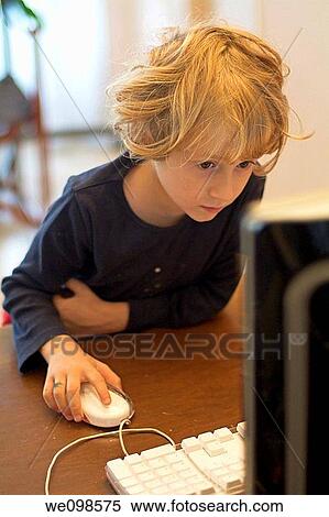 Portrait of a little girl playing on an apple computer at home View Large Photo Image Stock Photography - Portrait of a little girl playing on an apple computer at home. Fotosearch