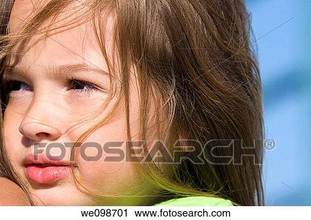 Portrait of a pretty five year old girl with long brown windblown hair, looking off to the side The girl is part Caucasian and part black View Large Photo Image Stock Image - Portrait of a pretty five year old girl with long brown windblown hair, looking off to the side The girl is part Caucasian and part black. Fotosearch
