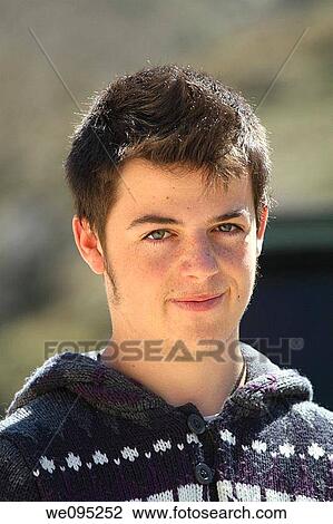 Portrait of a young guy smiling outdoors View Large Photo Image Stock Image - Portrait of a young guy smiling outdoors. Fotosearch