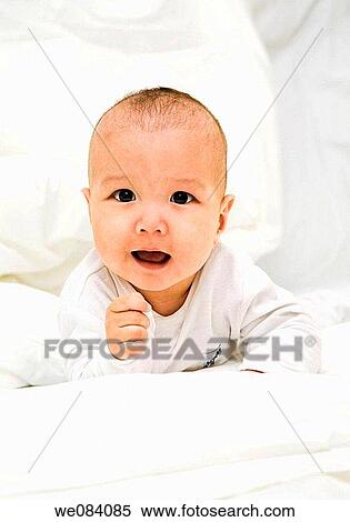 Portrait of adopted Kazakh baby View Large Photo Image Stock Photography - Portrait of adopted Kazakh baby. Fotosearch