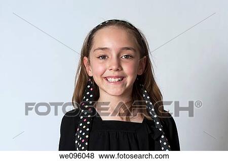 Portrait of average american 2nd grade middle school aged kids, looking at camera and smiling in studio white background View Large Photo Image Stock Photo - Portrait of average american 2nd grade middle school aged kids, looking at camera and smiling in studio white background. Fotosearch