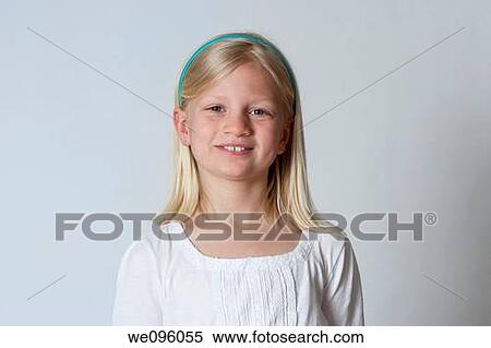 Stock Photography - Portrait of average american 2nd grade middle school aged kids, looking at camera and smiling in studio white background. Fotosearch