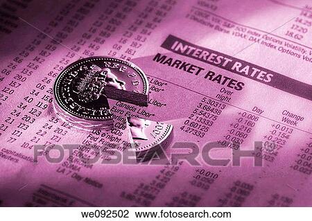 Pound coin with segment taken out on financial newspaper View Large Photo Image Stock Image - Pound coin with segment taken out on financial newspaper. Fotosearch