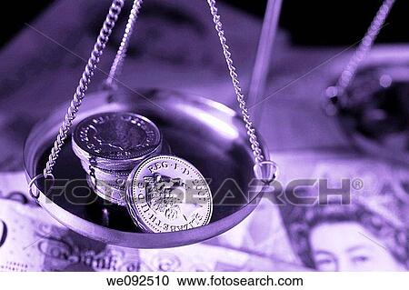 Pound coins in pan of weighing balance View Large Photo Image Stock Image - Pound coins in pan of weighing balance. Fotosearch