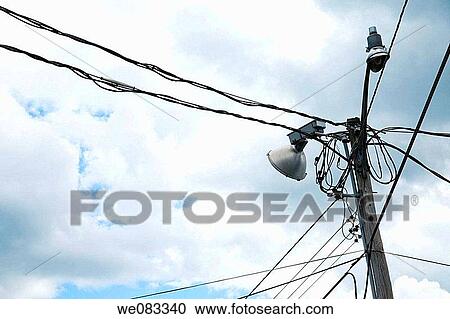 Power lines with a streetlight and loudspeaker. View Large Photo Image Stock Image - Power lines with a streetlight and loudspeaker.. Fotosearch