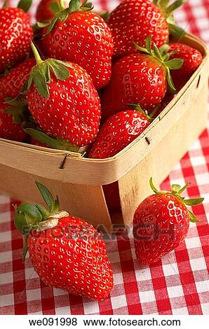 Punnet of fresh strawberries on gingham tablecloth View Large Photo Image Stock Photo - Punnet of fresh strawberries on gingham tablecloth. Fotosearch