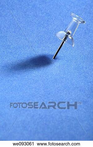 Pushpin on blue paper View Large Photo Image Stock Image - Pushpin on blue paper. Fotosearch