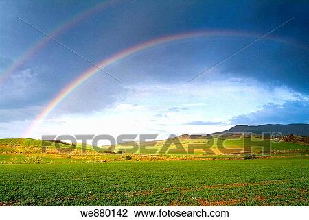 Stock Image - Rainbow over fields. La Rioja, Spain. Fotosearch