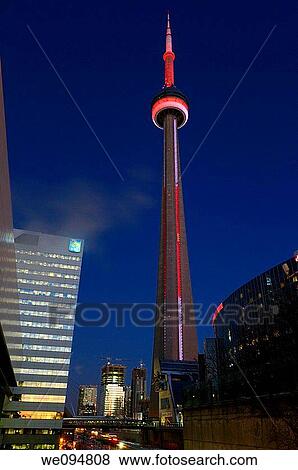 Red and white lights on the Toronto CN Tower from the railway line at dusk View Large Photo Image Stock Photo - Red and white lights on the Toronto CN Tower from the railway line at dusk. Fotosearch