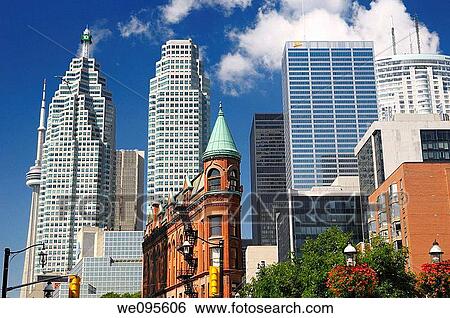 Red brick Flatiron building in front of downtown Toronto skyscrapers View Large Photo Image Stock Photograph - Red brick Flatiron building in front of downtown Toronto skyscrapers. Fotosearch