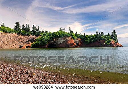 Red sandstone sea caves at St Martins New Brunswick at Bay of Fundy high tide View Large Photo Image Picture - Red sandstone sea caves at St Martins New Brunswick at Bay of Fundy high tide. Fotosearch