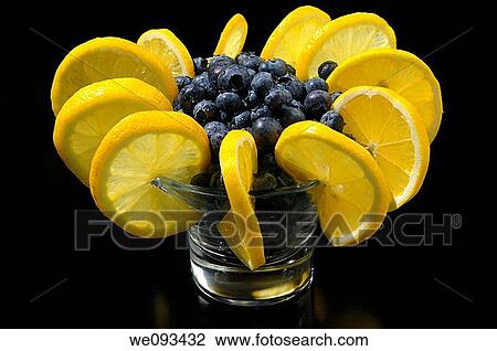 Ring of lemons in a fruit cup with wet blueberries on black View Large Photo Image Stock Image - Ring of lemons in a fruit cup with wet blueberries on black. Fotosearch