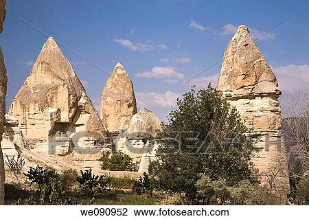 Rock-cut cave dwellings in the Valley of Love near Goreme, Cappadocia region, Turkey View Large Photo Image Stock Image - Rock-cut cave dwellings in the Valley of Love near Goreme, Cappadocia region, Turkey. Fotosearch