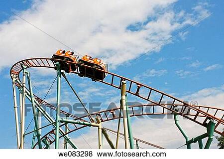 Rollercoaster at a theme park View Large Photo Image Stock Photo - Rollercoaster at a theme park. Fotosearch