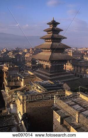 Roofs of the five-story Hindu Nyatapola Temple rising above buildings of the UNESCO World Heritage town of Bhaktapur at sunset- Kathmandu Valley, Nepal View Large Photo Image Picture - Roofs of the five-story Hindu Nyatapola Temple rising above buildings of the UNESCO World Heritage town of Bhaktapur at sunset- Kathmandu Valley, Nepal. Fotosearch