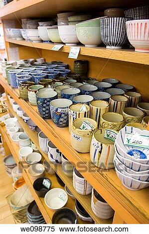 Stock Photography - Rows of ceramic teacups and small bowls on the shelves of a pottery shop on Kappabashi Street restaurant supply district of Tokyo, Japan Prices are shown in Japanese yen. Fotosearch