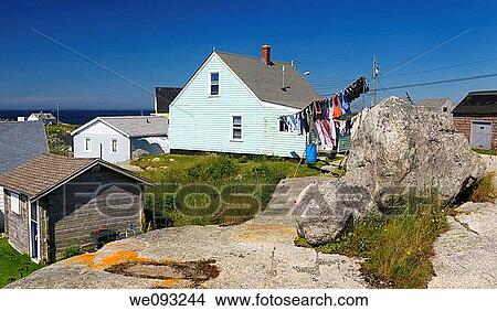 Rural fishing village houses and laundry at Peggys Cove Nova Scotia View Large Photo Image Picture - Rural fishing village houses and laundry at Peggys Cove Nova Scotia. Fotosearch