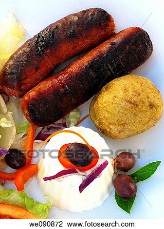 Sausages and grilled potato salad View Large Photo Image Stock Image - Sausages and grilled potato salad. Fotosearch