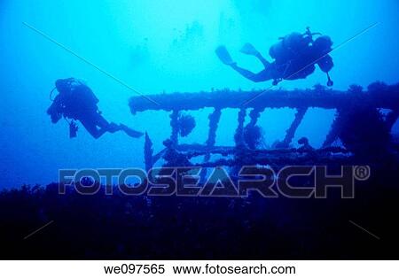 Scuba divers exploring the greek shipwreck, France, Cavalaire View Large Photo Image Stock Photography - Scuba divers exploring the greek shipwreck, France, Cavalaire. Fotosearch