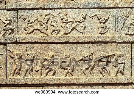 Sculptures on the outer wall of the Ramachandra temple in Hampi, Karnataka. Ramachandra temple, also called Hazara Rama (? One thousand Ramas? ), was built in the 1420s by the great king in the name of Devaraya 1I as a royal chapel dedicated to the cult of View Large Photo Image Picture - Sculptures on the outer wall of the Ramachandra temple in Hampi, Karnataka. Ramachandra temple, also called Hazara Rama (? One thousand Ramas? ), was built in the 1420s by the great king in the name of Devaraya 1I as a royal chapel dedicated to the cult of. Fotosearch
