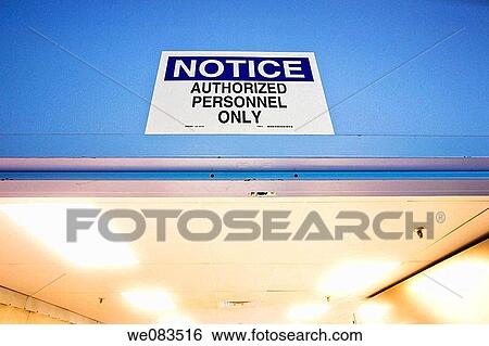 Sign above a door in a factory reading,? Notice - Authorized Personnel Only?. View Large Photo Image Stock Photograph - Sign above a door in a factory reading,? Notice - Authorized Personnel Only?.. Fotosearch
