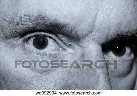 Sinister looking close up of an old mans eyes in monochrome View Large Photo Image Picture - Sinister looking close up of an old mans eyes in monochrome. Fotosearch