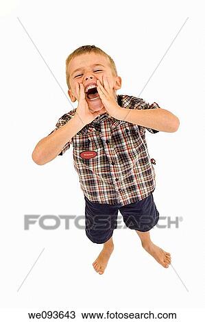 Six year old boy standing on white background shouting and wearing casual clothes View Large Photo Image Stock Image - Six year old boy standing on white background shouting and wearing casual clothes. Fotosearch