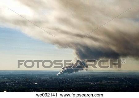 Stock Image - Smoke from a fire in the distance Rome Italy. Fotosearch