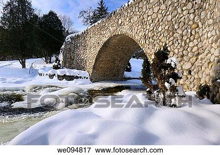 Spencer Creek running under a stone bridge at Webster Falls Conservation Area Park in winter View Large Photo Image Stock Photo - Spencer Creek running under a stone bridge at Webster Falls Conservation Area Park in winter. Fotosearch