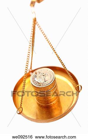 Stack of pound coins in pan of weighing balance View Large Photo Image Stock Photograph - Stack of pound coins in pan of weighing balance. Fotosearch