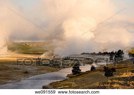 Steam rises from inside the earth into the cold morning air along Yellowstone Park's Firehole River View Large Photo Image Stock Photo - Steam rises from inside the earth into the cold morning air along Yellowstone Park's Firehole River. Fotosearch