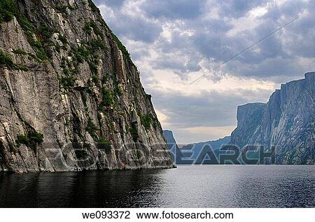Steep Igneous rock wall at Western Brook Pond inland fjord at Gros Morne National Park Newfoundland View Large Photo Image Stock Image - Steep Igneous rock wall at Western Brook Pond inland fjord at Gros Morne National Park Newfoundland. Fotosearch