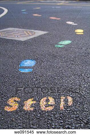 Step... A coloured trail of footprints in a school yard. View Large Photo Image Stock Photography - Step... A coloured trail of footprints in a school yard.. Fotosearch