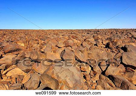 Stock Photo - Stone-covered Hammada desert on the Mesak Settafek plateau, Fezzan, Libya. Fotosearch