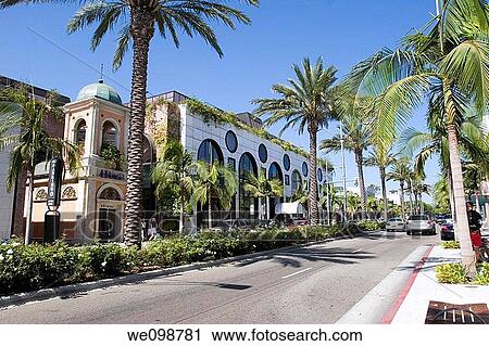 Street scene on Rodeo Drive, Beverly Hills, Los Angeles, California Palm trees line both sides of the street and the landscaped center divide, and people are walking by the expensive stores along the street View Large Photo Image Stock Image - Street scene on Rodeo Drive, Beverly Hills, Los Angeles, California Palm trees line both sides of the street and the landscaped center divide, and people are walking by the expensive stores along the street. Fotosearch