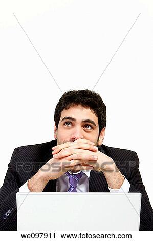 Stressed business man working in office with laptop View Large Photo Image Stock Image - Stressed business man working in office with laptop. Fotosearch