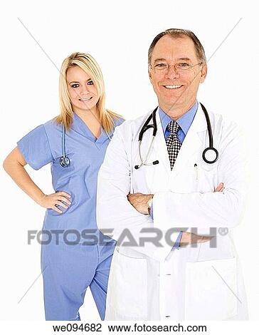 Successful doctors smiling over a white background View Large Photo Image Stock Image - Successful doctors smiling over a white background. Fotosearch